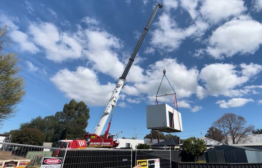 The pod was lifted off Grace Katon's property on Wednesday, but the roll out continues for other residents who can't get back in their own home yet.
