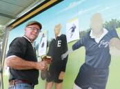 Brian Stringer from Kempsey adding the detail to the players on the Eugowra rugby league centenary mural in 2021. The mural was lost in the flood, and will be recreated this year. File picture