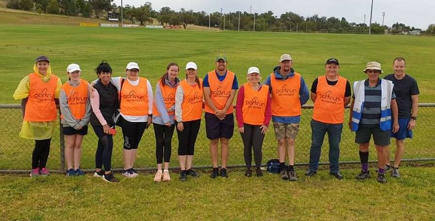 FLURO LEGENDS: Some of the amazing parkrun volunteers on March 20 at Northparkes Oval. Photo: Supplied.