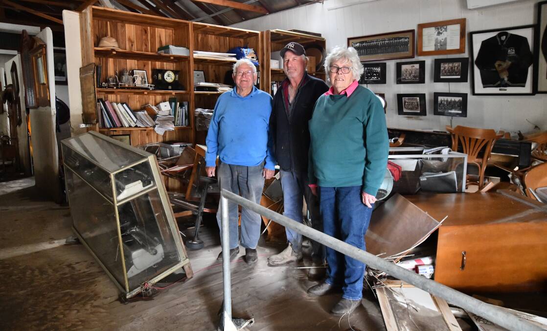 Max Swift, Ray Agustin and Margaret Swift at the Eugowra Museum and Bushranger Centre just two days after the flood. Picture by Carla Freedman