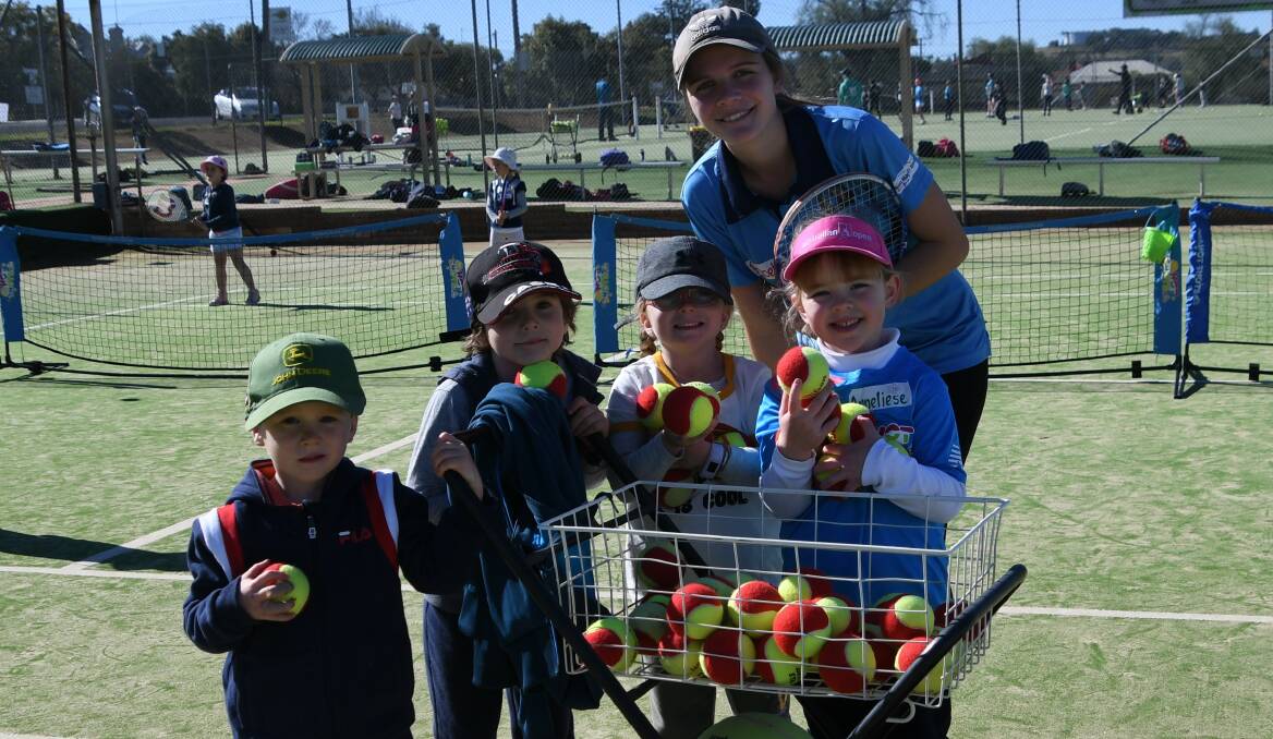 TENNIS CAMP: Archie Orr, Henry Swift, Pippa and Annaliese helped Phoebe Potts collect tennis balls during the school holiday tennis camp. Photo: Jenny Kingham