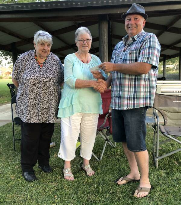 President of the Central West Car Club Rodney Barnes (right) presents Anne McLachlan and Pat Bailey from Parkes Can Assist with the cheque. Picture by Jeff McClurg